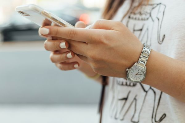 woman holding a phone