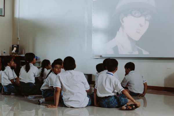 young students in Thailand watching anime inside a classroom