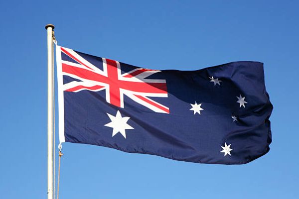 in-text image 15 The National flag of Australia against blue sky.