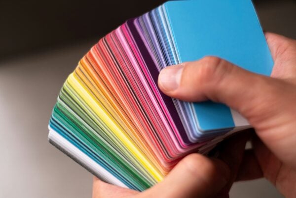 hands holding paint samples