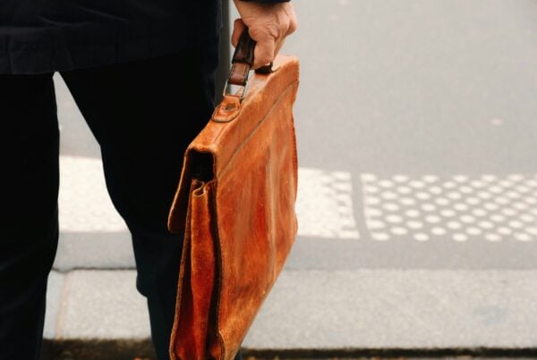 person carrying briefcase