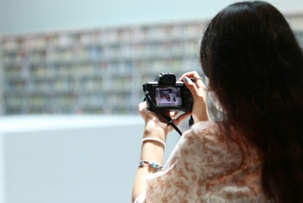 woman taking a photograph with a camera